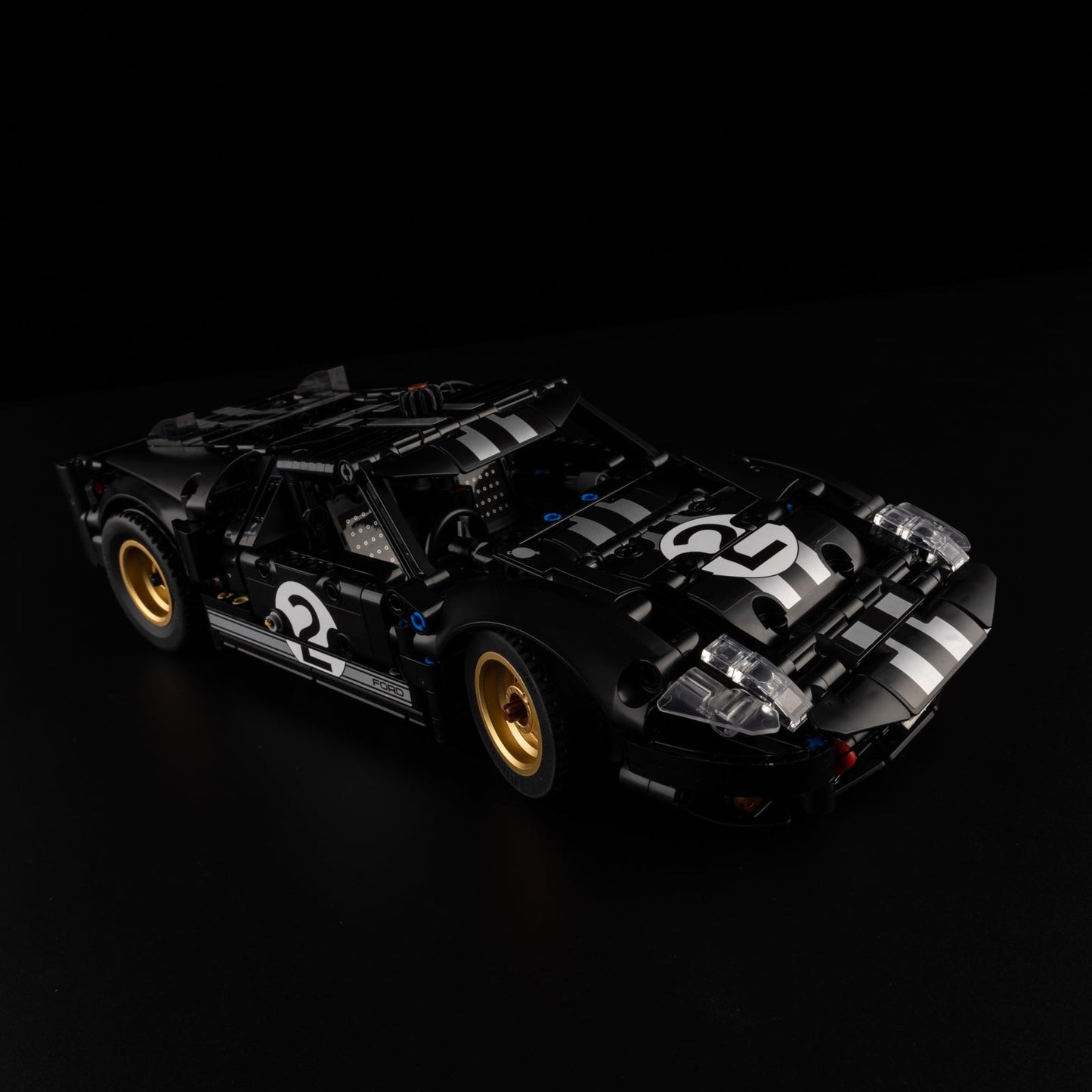 Light Kit for LEGO 1966 Ford GT40 MKII Race Car 42223 - front three-quarter view with LED headlights and blue engine glow