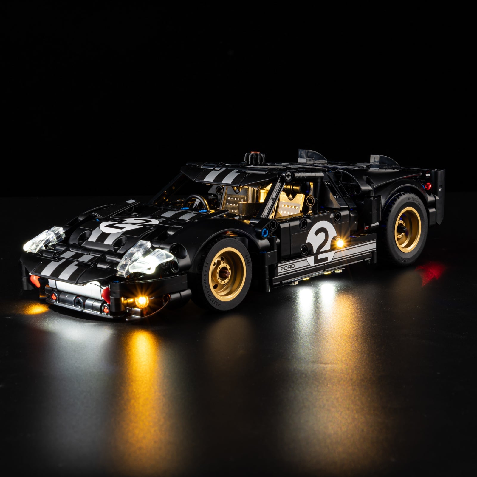 Light Kit for LEGO 1966 Ford GT40 MKII Race Car 42223 - top-down view showing golden interior and blue roof lighting