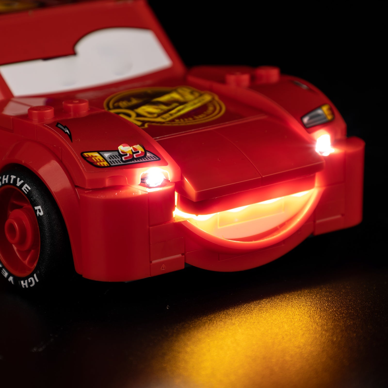 Light Kit for LEGO Lightning McQueen 77255 - detail of front bumper smile with warm LED light